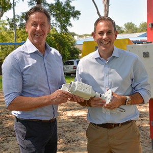 An image of City of Logan Mayor Darren Power (left) and Federal Treasurer Jim Chalmers with a multi-directional safety camera in Rowan Park at Slacks Creek.
