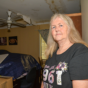 Surveying the damage in her Kingston home is Barbara Cole.