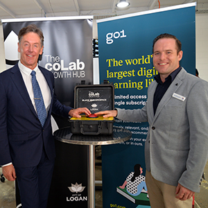An image of City of Logan Mayor Darren Power (left) and Deputy Mayor Jon Raven, pushing a button to  launch Logan City Council's new coLab Growth Hub innovation incubator at Underwood.