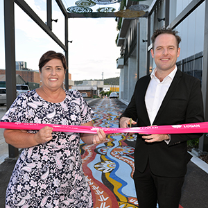 Deputy Mayor Jon Raven and Division 12 Councillor Karen Murphy cut a ribbon across the new mural in John Lane which is part of the Beenleigh CBD streetscaping project.