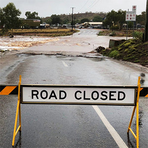 An image of a flooded road to urge reader that if it is flooded forget it