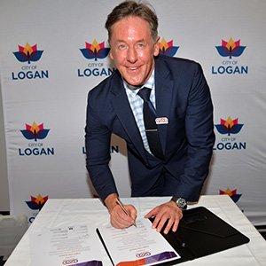 An image of City of Logan Mayor Darren Power signing the Small Business Friendly charter