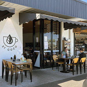 An image of the front of St Coco café at Daisy Hill, showing awnings and tables and chairs to demonstrate a local example of what can be achieved through a stylish upgrade and footpath dining.