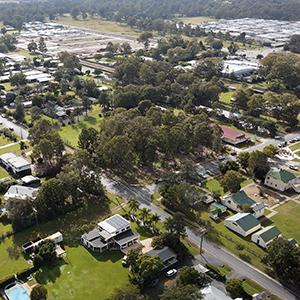 An aerial view of Logan Village, where planning has included the redevelopment of the Village Green playground, a recreation trail to nearby Yarrabilba and sealed pathways linking residential areas to the local business and shopping precinct.