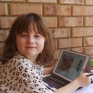 This is an image of a girl on a computer.