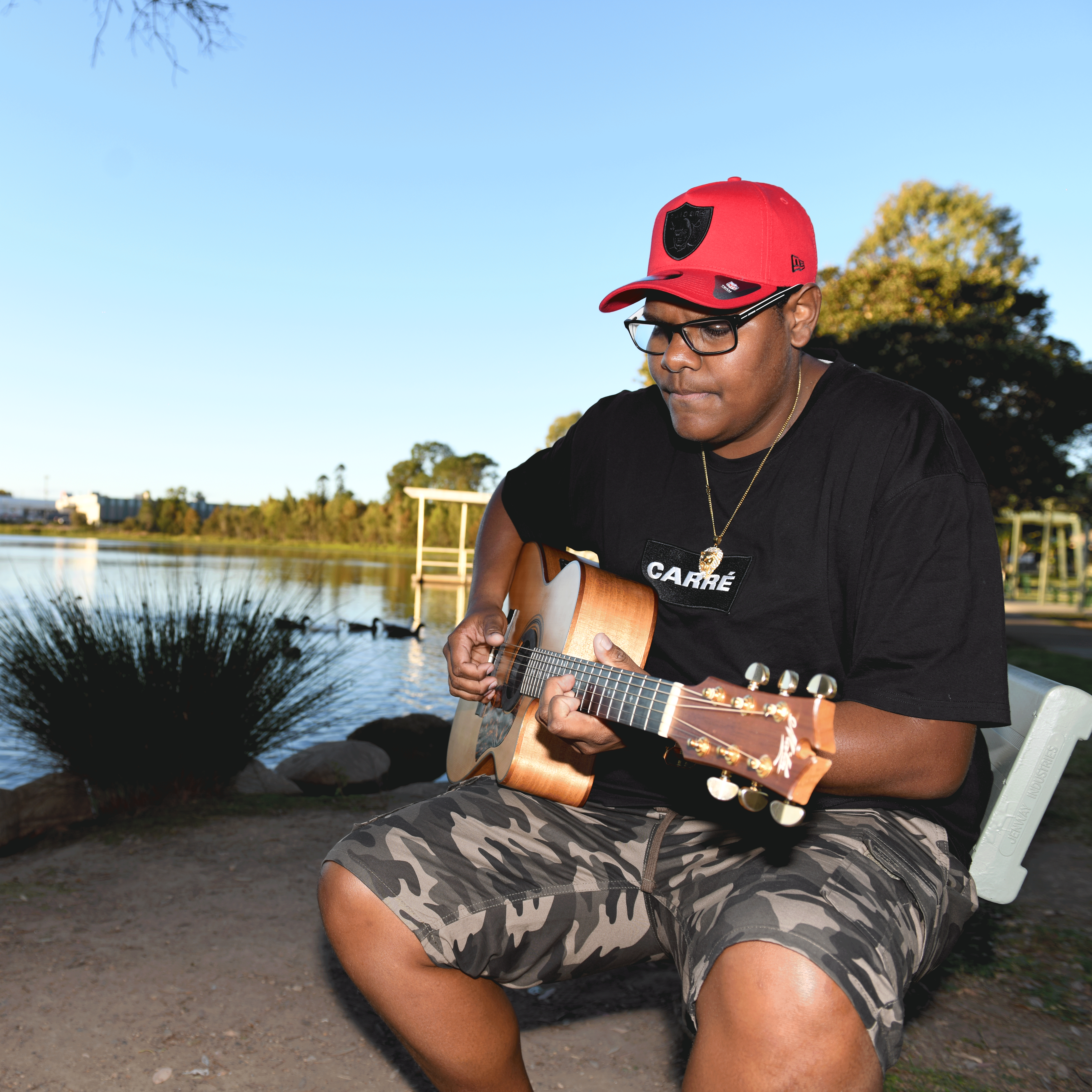 A picture of guitarist Chris Tamwoy, who returns to perform in City of Logan next month.