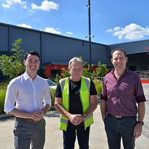 Hooning Taskforce Chair Councillor Jacob Heremaia, Deputy Mayor and Division 5 Councillor Jon Raven (right) and Pinnacle Hardware operations manager John Chesser in front of the new surveillance camera installed at the business.