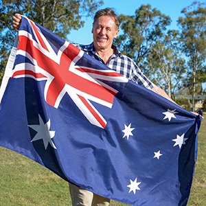Mayor Darren Power with an Australian flag.
