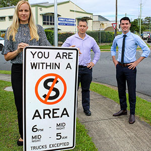Hooning Taskforce Chair Cr Jacob Heremaia, deputy chair Tim Frazer and Division 10 Councillor Miriam Stemp with one of the no-stopping signs installed to deter hooning in the Loganholme industrial estate.