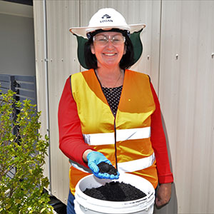City Infrastructure Chair Councillor Teresa Lane with a handful of biochar.