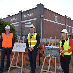 A photograph of  Local Government Minister Stirling Hinchliffe, Logan Mayor Darren Power and Member for Waterford Shannon Fentiman outside the Kingston Butter Factory in Logan.