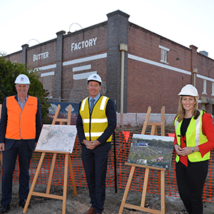 A photograph of Local Government Minister Stirling Hinchliffe, Logan Mayor Darren Power and Member for Waterford Shannon Fentiman outside the Kingston Butter Factory in Logan.