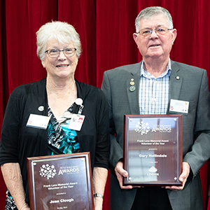 A photograph of the dual winners of Logan's 2019 Frank Lenz Memorial Award for Volunteer of the Year, Joan Clough and Gary Hollindale.