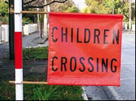 picture of a children's crossing flat that indicated children crossing during school times