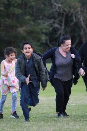 A family running through a field