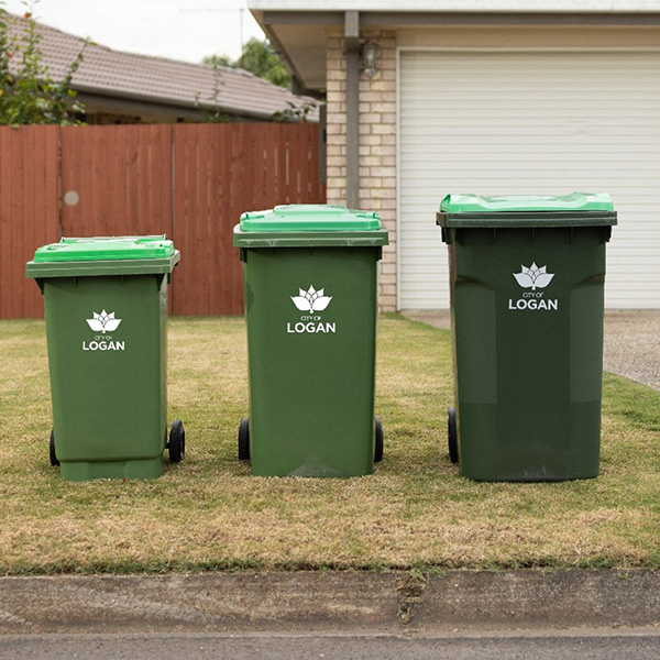 140 litre, 240 litre and 360 litre green bins positioned on the footpath out the front of a house