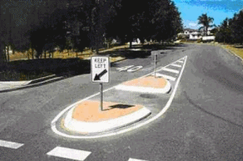 picture of a traffic island located in the middle of the street