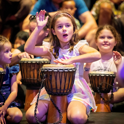 A girl playing percussions