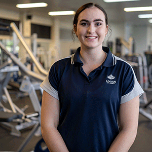 Trainer stands in gym