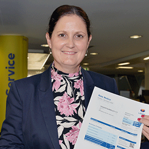 Woman holds Council rates notice