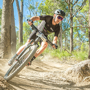 Cyclist Robbie McEwen rides a bicycle.