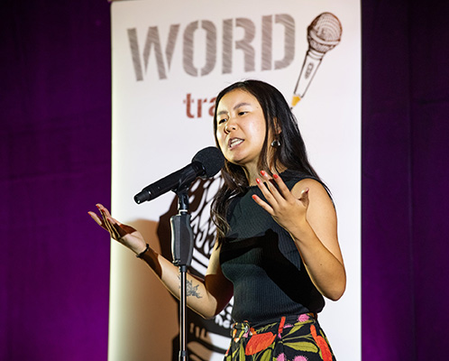 Female poet performs on stage