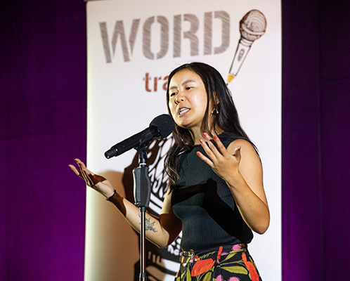 Female poet performs on stage